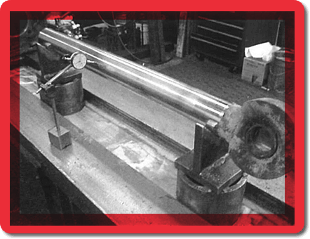 Rod straightness and chrome condition is checked . The rod is then straightened, polished or re-chromed as required in order to restore it to factory specifications